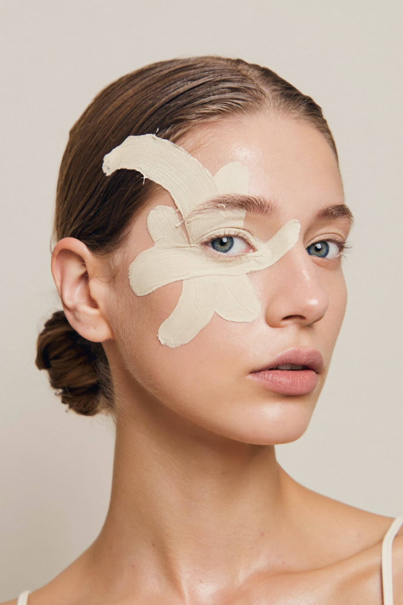 Avant-garde beauty look with sculptural cream tones